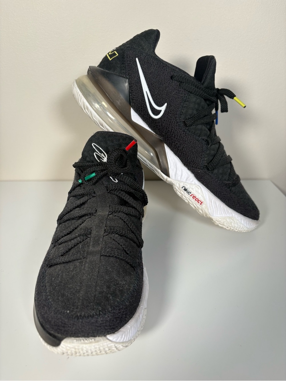 Nike Black Sneakers with White Swoosh and Multicolor Lace Accents